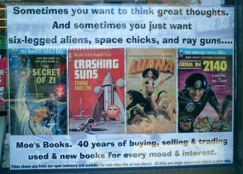 Photo of Moe's books shop window:  'Sometimes you want to think great thoughts.  And sometimes you just want six-legged aliens, space chicks, and ray guns....'